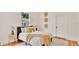 Cozy bedroom with a plush bed, decorative wall art, and a window offering natural light at 219 Laurel Ave, Sanford, FL 32771