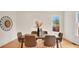 Dining room with hardwood floors, seating for six, and stylish decor at 219 Laurel Ave, Sanford, FL 32771