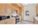 Modern kitchen features custom wood cabinets, stainless steel appliances, and quartz countertops at 219 Laurel Ave, Sanford, FL 32771
