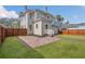 Large backyard with patio and wooden fence at 219 Laurel Ave, Sanford, FL 32771