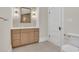 Bathroom with new vanity, tile flooring, and a classic toilet at 219 Laurel Ave, Sanford, FL 32771