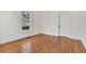 Charming bedroom with hardwood floors and a window at 219 Laurel Ave, Sanford, FL 32771