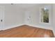 Bright bedroom with hardwood floors and a window at 219 Laurel Ave, Sanford, FL 32771