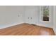 Well-lit bedroom, hardwood floors and two doors at 219 Laurel Ave, Sanford, FL 32771
