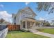 Two-story craftsman home with a wrap-around porch and fenced yard at 219 Laurel Ave, Sanford, FL 32771