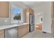 Modern kitchen with light wood cabinets, stainless steel appliances at 219 Laurel Ave, Sanford, FL 32771