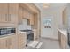Modern kitchen features updated cabinetry, appliances, and tile backsplash at 219 Laurel Ave, Sanford, FL 32771