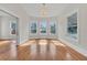 Bright living room with hardwood floors, bay windows, and fireplace at 219 Laurel Ave, Sanford, FL 32771