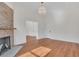 Living room with hardwood floors, fireplace and access to other rooms at 219 Laurel Ave, Sanford, FL 32771
