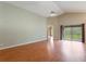 Bright and airy living area with hardwood floors and access to backyard at 2306 Quaker Ct, Orlando, FL 32837