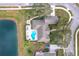Property with a large backyard featuring a pool, firepit, patio, and waterside access at 278 Eaglet Way, Lake Mary, FL 32746