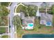 Aerial view of house, pool, and backyard; located on a lake at 278 Eaglet Way, Lake Mary, FL 32746