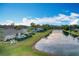 Lakefront property showcasing a house with a pool at 278 Eaglet Way, Lake Mary, FL 32746