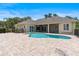 Spacious backyard featuring a pool, spa, patio, and outdoor seating, perfect for relaxation at 278 Eaglet Way, Lake Mary, FL 32746