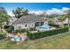 Backyard with pool, spa, and firepit provides entertainment options surrounded by lush greenery at 278 Eaglet Way, Lake Mary, FL 32746