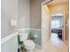 Simple bathroom with toilet and view of bedroom and hallway at 278 Eaglet Way, Lake Mary, FL 32746