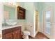 Charming bathroom featuring a vessel sink, wood accents, and tiled walk-in shower at 278 Eaglet Way, Lake Mary, FL 32746