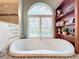 Elegant bathroom with soaking tub and large window at 278 Eaglet Way, Lake Mary, FL 32746