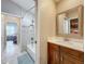 Updated bathroom with single vanity and a view into a bathtub at 278 Eaglet Way, Lake Mary, FL 32746