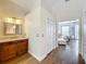 Bathroom featuring wood-look tile floors, a vanity, and entry to the main bedroom at 278 Eaglet Way, Lake Mary, FL 32746