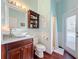 Bathroom with outdoor access and cherry wood furnishings at 278 Eaglet Way, Lake Mary, FL 32746