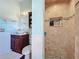 Well-lit bathroom with walk-in shower, vessel sink, and decorative accents at 278 Eaglet Way, Lake Mary, FL 32746