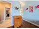 Light and airy bedroom with wood-look floors and a dresser at 278 Eaglet Way, Lake Mary, FL 32746