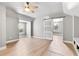 Spacious bedroom features a ceiling fan, light gray walls, and a sliding barn door to another room at 278 Eaglet Way, Lake Mary, FL 32746