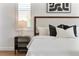 Bedroom featuring a well-made bed, stylish nightstand, and artwork, creating a cozy retreat at 278 Eaglet Way, Lake Mary, FL 32746