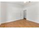 Light filled bedroom with wood floors, white walls, open closet, and a white door at 278 Eaglet Way, Lake Mary, FL 32746