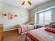 Charming bedroom with twin beds and a window seat, perfect for relaxing at 278 Eaglet Way, Lake Mary, FL 32746