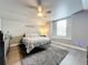 Serene bedroom featuring a queen-size bed, neutral decor, and ample natural light from the window at 278 Eaglet Way, Lake Mary, FL 32746