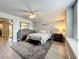Neutral bedroom with an accent rug and ceiling fan at 278 Eaglet Way, Lake Mary, FL 32746