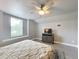 Bedroom with large window, ceiling fan, and dresser at 278 Eaglet Way, Lake Mary, FL 32746
