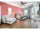 Relaxing bedroom with a comfortable sitting area and access to the pool at 278 Eaglet Way, Lake Mary, FL 32746