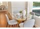 Cozy dining area with a round glass table and seating for four at 278 Eaglet Way, Lake Mary, FL 32746