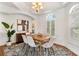 Elegant dining room with modern decor, a tray ceiling, and ample natural light at 278 Eaglet Way, Lake Mary, FL 32746