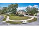 Beautifully landscaped home featuring a circular driveway and mature trees on a well-maintained lot at 278 Eaglet Way, Lake Mary, FL 32746