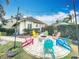 Cozy backyard fire pit with colorful chairs, ideal for relaxing and enjoying the outdoors at 278 Eaglet Way, Lake Mary, FL 32746