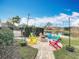 Charming fire pit area with colorful chairs and string lights at 278 Eaglet Way, Lake Mary, FL 32746