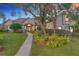 Stunning home exterior with mature trees, lush landscaping, and a welcoming walkway to the front entrance at 278 Eaglet Way, Lake Mary, FL 32746