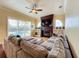 Gathering room with sectional sofa and fireplace at 278 Eaglet Way, Lake Mary, FL 32746