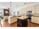 Spacious open kitchen featuring granite countertops, stainless appliances, and seamless flow into the living area at 278 Eaglet Way, Lake Mary, FL 32746