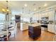 Open concept kitchen with granite island and stainless steel appliances at 278 Eaglet Way, Lake Mary, FL 32746