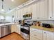 Modern kitchen featuring granite countertops and stainless steel appliances at 278 Eaglet Way, Lake Mary, FL 32746