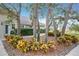 Front yard landscaping with ornamental plants surrounding mature trees creating a lovely outdoor space at 278 Eaglet Way, Lake Mary, FL 32746