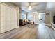 Cozy living room with a comfortable sectional sofa, ceiling fan, and stylish sliding barn door at 278 Eaglet Way, Lake Mary, FL 32746