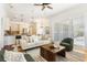 Open-concept living room with modern furnishings, seamlessly connected to the kitchen and dining area at 278 Eaglet Way, Lake Mary, FL 32746