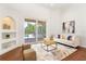 Inviting living room with a comfortable couch, stylish decor, and a view of the pool area at 278 Eaglet Way, Lake Mary, FL 32746