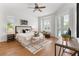 Serene main bedroom with ample natural light, stylish furnishings, and access to the outdoors at 278 Eaglet Way, Lake Mary, FL 32746